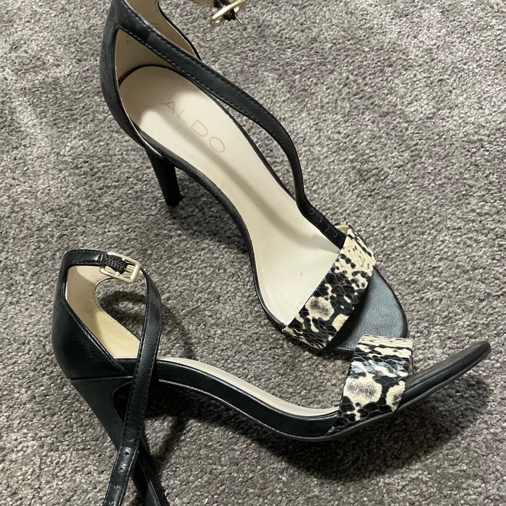 Pair of Aldo black and white sandals